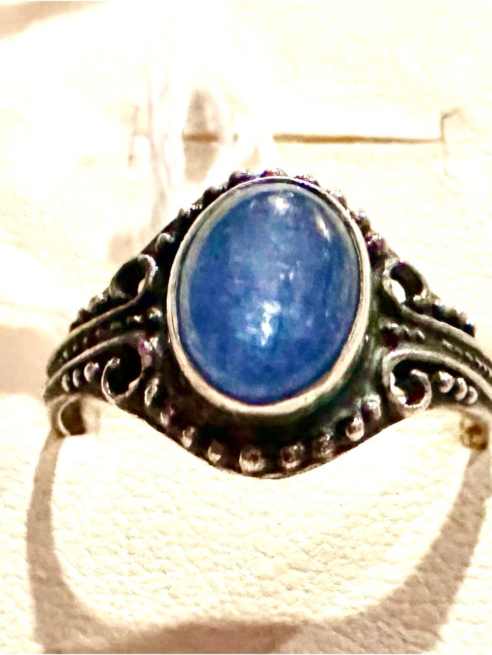 Sterling Silver Scroll Band with Blue Sapphire Stone.